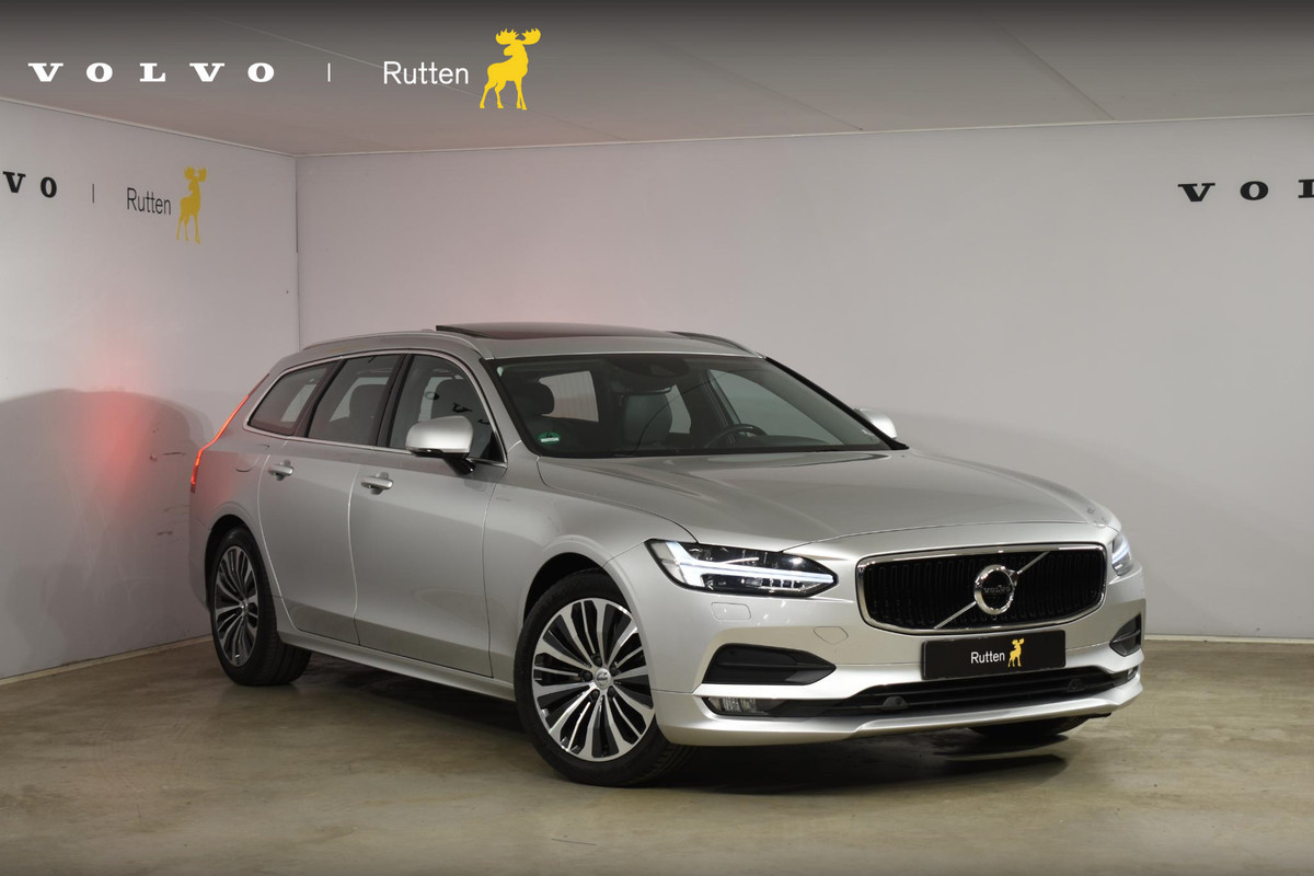 Volvo V90 T4 Business Luxury+ / Adaptive Cruise control / Elektrisch Panoramadak / Trekhaak / Stoelverwarming voor+achter / Verwarmde achterbank / Achteruitrijcamera / Elek. stoelen / Geheugen bestuurdersstoel Volvo V90 T4 Business Luxury+ / Adaptive Cruise control / Elektrisch Panoramadak / Trekhaak / Stoelverwarming voor+achter / Verwarmde achterbank / Achteruitrijcamera / Elek. stoelen / Geheugen bestuurdersstoel