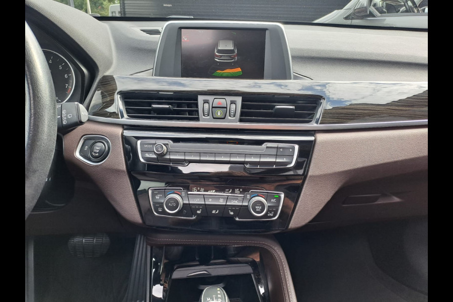 BMW X1 sDrive18i High Executive | Automaat | Leder | Pano | Trekhaak | Cruise | PDC | All-seasons |
