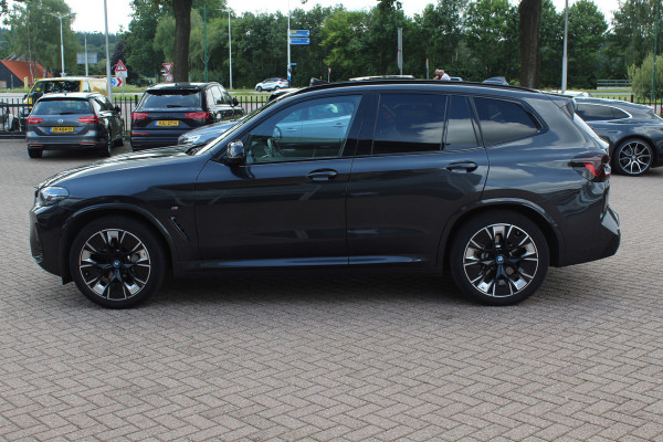 BMW iX3 High Executive 80 kWh / SoH 98.4% / Trekhaak / Panoramadak / 360Camera / Head-up / 20'' / Leder / Harman Kardon / Sfeerverlichting / Dodehoek / DAB / Stuur+Stoelverwarming / ACC