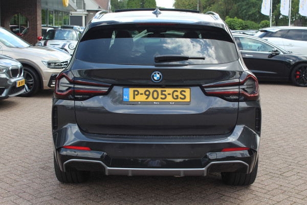 BMW iX3 High Executive 80 kWh / SoH 98.4% / Trekhaak / Panoramadak / 360Camera / Head-up / 20'' / Leder / Harman Kardon / Sfeerverlichting / Dodehoek / DAB / Stuur+Stoelverwarming / ACC