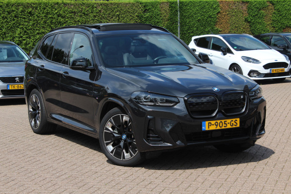 BMW iX3 High Executive 80 kWh / SoH 98.4% / Trekhaak / Panoramadak / 360Camera / Head-up / 20'' / Leder / Harman Kardon / Sfeerverlichting / Dodehoek / DAB / Stuur+Stoelverwarming / ACC