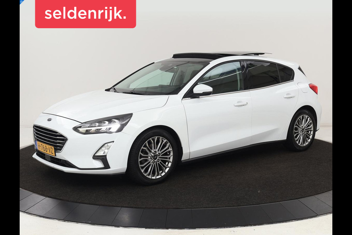 Ford Focus 1.0 EcoBoost Titanium | Panoramadak | Head-Up | Stoel & stuurverwarming | Adaptive cruise | B&O Sound | Full LED | Carplay | Keyless | Climate control | Navigatie | Parkeerhulp Ford Focus 1.0 EcoBoost Titanium | Panoramadak | Head-Up | Stoel & stuurverwarming | Adaptive cruise | B&O Sound | Full LED | Carplay | Keyless | Climate control | Navigatie | Parkeerhulp