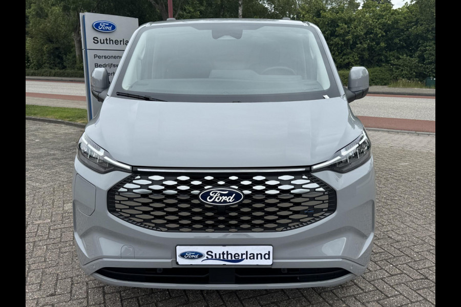 Ford E-Transit Custom 340 L2 Limited/Titanium 65 kWh / 218pk | SCI | Ford voorraad | Premium Lak: Grey Matter, Limited interieurbekleding, verwarmbare passagiersstoel (8-weg verstelbaar), centrale dubbele vergrendeling, 17 inch lichtmetalen velgen, Driver Assistance Pack, AGM Accu, BEV 3-fase oplaadkabel (mode 3, 32A, 10m) Vehicle Integration System Ford Voorraad