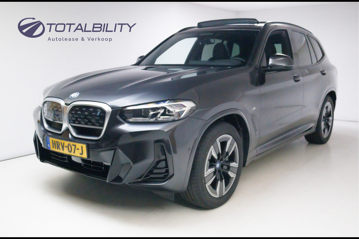 BMW iX3 M-Sport Shadowline 80 kWh 286 PK | Pano | Leer | Elect. stoelen best. met geh. | Camera | Parkeerassistent pakket Licht- en regensensor, PDC, Sportstoelen, Stoelverwarming, Led, Camera, Privacy glas BMW iX3 M-Sport Shadowline 80 kWh 286 PK | Pano | Leer | Elect. stoelen best. met geh. | Camera | Parkeerassistent pakket Licht- en regensensor, PDC, Sportstoelen, Stoelverwarming, Led, Camera, Privacy glas