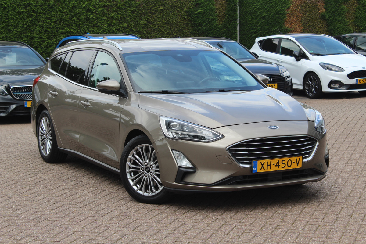 Ford FOCUS Wagon 1.0 EcoBoost Titanium Business / Trekhaak / Camera / B&O / 19'' / Keyless / Navigatie / Stuurverwarming / DAB / Stoelverwarming / Cruise Contro Ford FOCUS Wagon 1.0 EcoBoost Titanium Business / Trekhaak / Camera / B&O / 19'' / Keyless / Navigatie / Stuurverwarming / DAB / Stoelverwarming / Cruise Contro