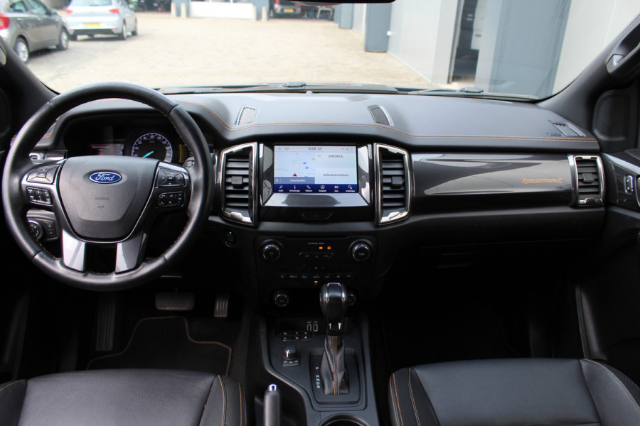Ford Ranger 2.0-213pk Bi-turbo 'Wildtrak' Supercab. AUTOMAAT / VIER wielaandrijving. Stoere vierwielaangedreven krachtpatser ! Trekgewicht 3.500kg ! Stoel- en voorraamverwarming, Autm. airco dual, Adaptieve cruise control, Navigatie, Telefoonvoorb., Trekhaak etc.
