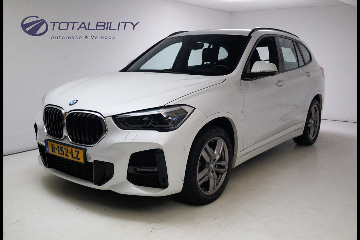 BMW X1 sDrive18i M-Sport 136 PK | Stoelverwarming | Elec. achterklep | PDC V+A | Cruise control, Led BMW X1 sDrive18i M-Sport 136 PK | Stoelverwarming | Elec. achterklep | PDC V+A | Cruise control, Led