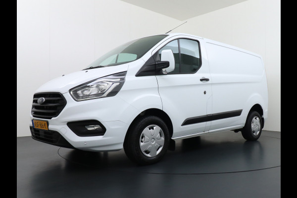 Ford Transit Custom 280 2.0TDCI 130PK L1H1 3-Persoons Apple Carplay Android Auto Airco Trekhaak Camera Cruise Control Pdc Voorruitverwarming Trend Regen-Lichtsensor Betonplex Vloer Wandbetimmering Schuifdeur Euro 6 385NM Koppel Zeer Compleet!