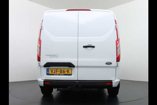 Ford Transit Custom 280 2.0TDCI 130PK L1H1 3-Persoons Apple Carplay Android Auto Airco Trekhaak Camera Cruise Control Pdc Voorruitverwarming Trend Regen-Lichtsensor Betonplex Vloer Wandbetimmering Schuifdeur Euro 6 385NM Koppel Zeer Compleet!