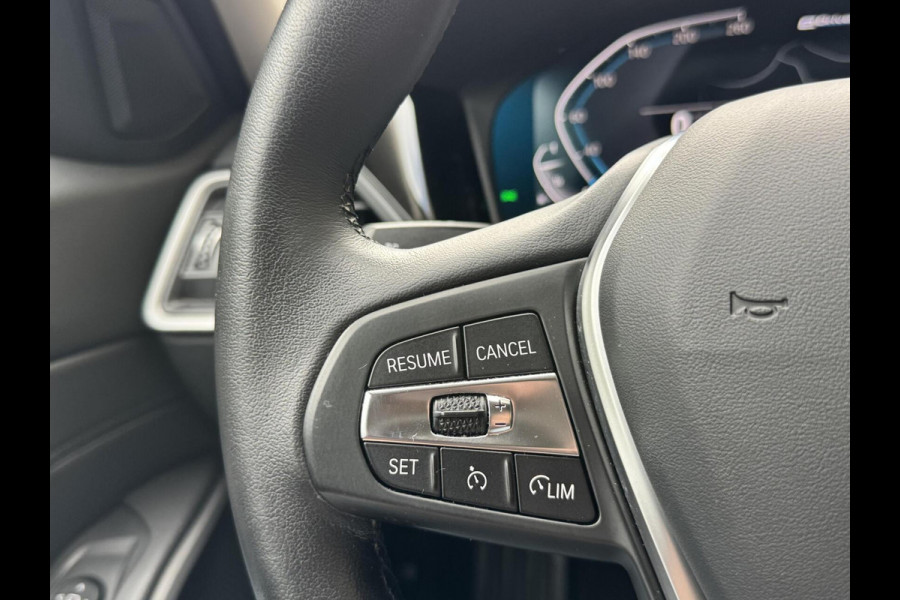 BMW 3 Serie Touring 320e High Executive Automaat | Trekhaak elektrisch | Navigatiesysteem | Laser LED | Draadloze telefoonlader | Apple CarP