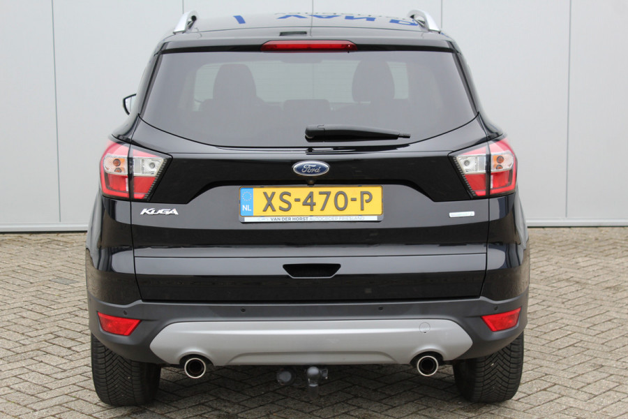 Ford Kuga 1.5-150pk EcoBoost Titanium. Trekgewicht 2.000kg ! Autm. airco dual, stoel-, stuur- en voorraamverwarming, cruise control, telefoonvoorb., navigatie, Sony soundsyst., LM wielen, trekhaak, privacy glass, All Season banden etc.