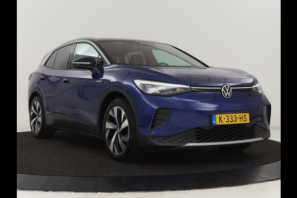 Volkswagen ID.4 First 77 kWh | Trekhaak | Sfeerverlichting | Camera | Navigatie | Stoelverwarming | Carplay | LMV 20 inch | LED | Cruise Control | Getint glas | Climate controle