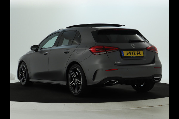 Mercedes-Benz A-Klasse 160 Business Solution AMG Panoramadak | 5 spaaks lichtmetalen velgen | Navigatie | Parking support met camera achter | elect bed. voorstoelen met memory | Inclusief 48 maanden Mercedes-Benz Certified garantie voor Europa.
