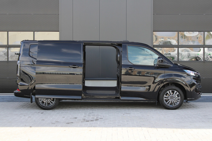 Ford Transit Custom 320 2.0 TDCI L2H1 Limited 150pk - 2x Schuifdeur - Adaptive Cruise - Verwarmd stuur - Blind spot - Navigatie - Camera - Draadloos Ford Transit Custom 320 2.0 TDCI L2H1 Limited 150pk - 2x Schuifdeur - Adaptive Cruise - Verwarmd stuur - Blind spot - Navigatie - Camera - Draadloos