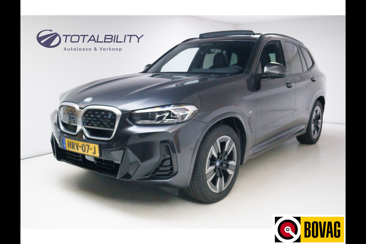 BMW iX3 M-Sport Shadowline 80 kWh 286 PK | Pano | Leer | Elect. stoelen best. met geh. | Camera | Parkeerassistent pakket Licht- en regensensor, PDC, Sportstoelen, Stoelverwarming, Led, Camera, Privacy glas BMW iX3 M-Sport Shadowline 80 kWh 286 PK | Pano | Leer | Elect. stoelen best. met geh. | Camera | Parkeerassistent pakket Licht- en regensensor, PDC, Sportstoelen, Stoelverwarming, Led, Camera, Privacy glas
