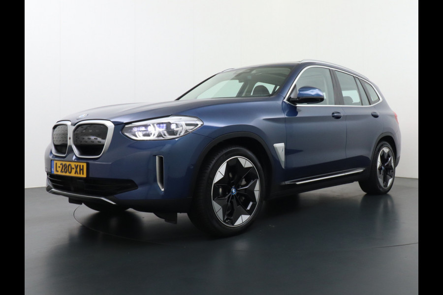 BMW iX3 High Executive 80kWh Leer+Elektr.-verst. Adap.Cruise Apple Carplay Android Auto Navi Ecc 360°Camera Panoramaschuifdak Harman&Kar Stoelverwarming Parkeer+Achteruitrij assistent Led Origineel Nederlandse Auto Zeer compleet! €73.000 nieuw!