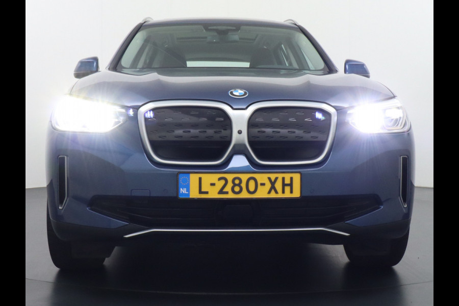 BMW iX3 High Executive 80kWh Leer+Elektr.-verst. Adap.Cruise Apple Carplay Android Auto Navi Ecc 360°Camera Panoramaschuifdak Harman&Kar Stoelverwarming Parkeer+Achteruitrij assistent Led Origineel Nederlandse Auto Zeer compleet! €73.000 nieuw!