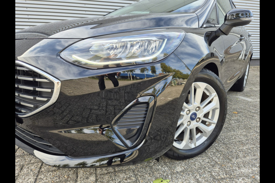 Ford Fiesta 1.0 EcoBoost Hybrid Titanium,Android/Carplay/navigatie,airco.cruise,stoel/stuur/voorruit verwarming,parkeesensoren,