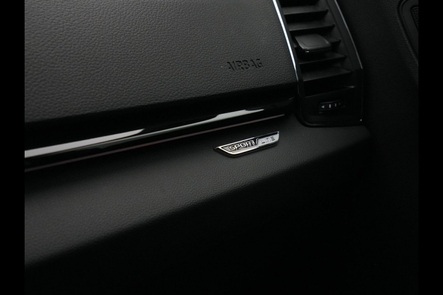 Škoda Karoq 1.5 TSI ACT 150pk DSG Sportline Business Navigatie CantonSound Stoelverwarming Camera Carplay Sideassist 199