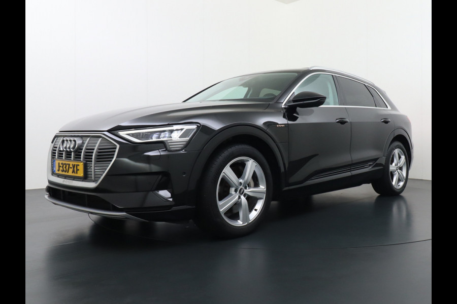 Audi e-tron 55 Quattro 95kWh 408PK Trekhaak Leder/Alcantara-Sportstoel Panoramadak Adap.Cruise Navi Ecc Stoelverwarming Business Edition Plus Luchtvering Memory Lmv Elek.Achterklep Privacy Glas Keyless 1e Eigenaar 1.800KG Trekgewicht Zeer compleet!