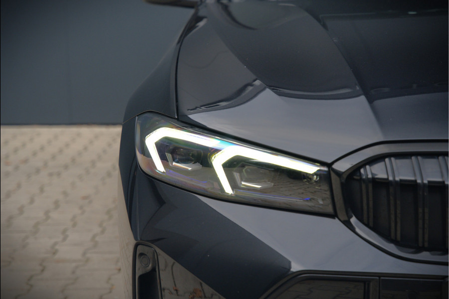BMW 3-serie 320e High Executive M Sport | Panoramadak | Harman Kardon | Carbon | Camera | Adaptive LED | Stoelverwarming | Stuurverwarming | Apple Carplay | Navigatie | Cruise Control | Memory Seat | Trekhaak | Keyless | Shadowline