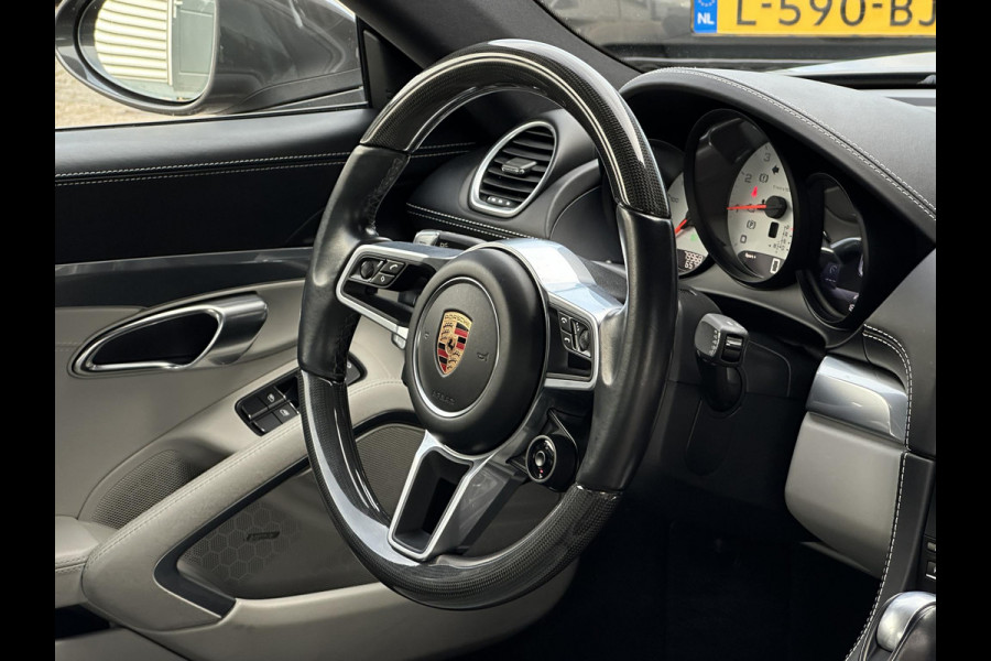 Porsche 718 Cayman 2.0 Sportchrono Adapt. Cruise BOSE Stuurverw. CarPlay Keyless LED 20”LM Agaatgrijs