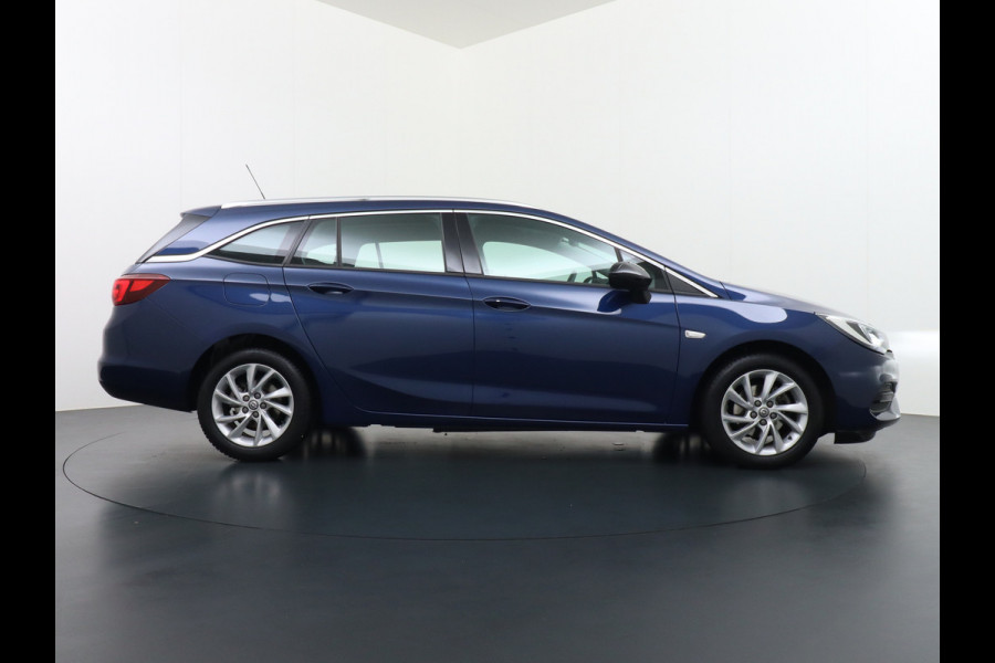 Opel Astra Sports Tourer 1.4T 145pk Navi Camera Lane-dep. Keyless 1/2Leer CruiseControl Led Bluetooth Pdc Apple/Android Aut.Verlichting Isofix Elek.Ramen Ecc Tel. Usb 16''LM Business Elegance
