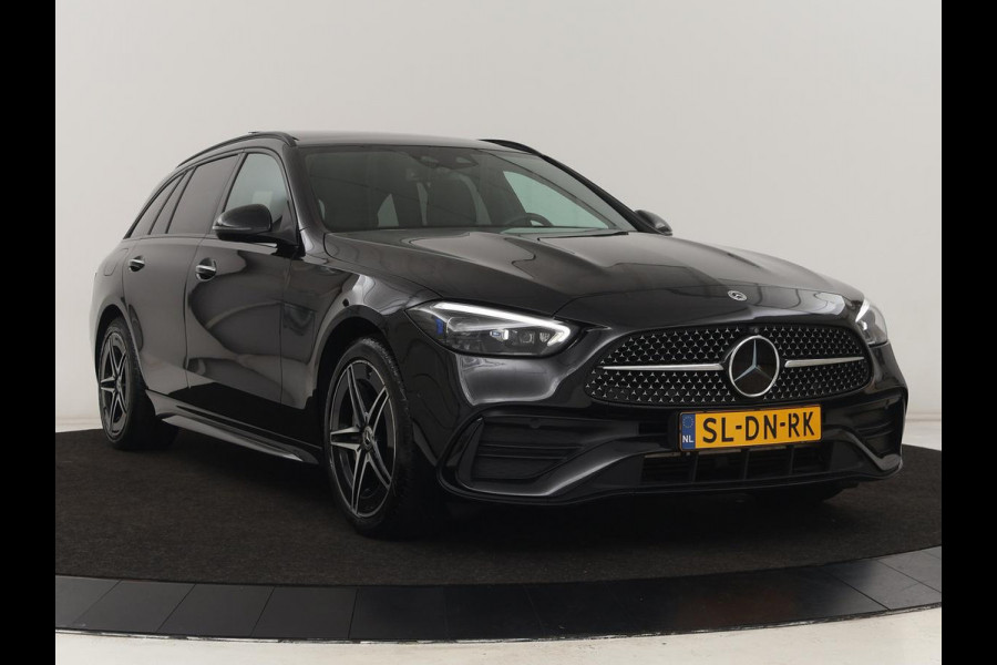 Mercedes-Benz C-Klasse 300e AMG Line | Panoramadak | Trekhaak | 360 Camera | Leder | Stoelverwarming | Adaptive cruise | Memory | Sfeerverlichting | PHEV | Plug In
