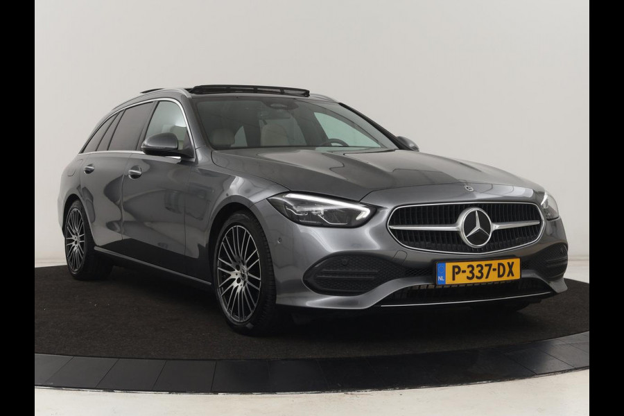 Mercedes-Benz C-Klasse 200 Launch Edition Luxury Line | Panoramadak | Trekhaak | Leder | Stoelverwarming | Carplay | Camera | Sfeerverlichting | Navigatie | 18'' | Getint glas