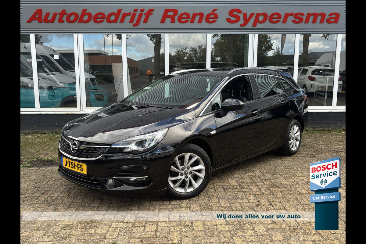 Opel Astra Sports Tourer 1.2 Ultimate 146 PK | Trekhaak | Stoel Verwarming | Stuur Verwarming | Parkeer Camera Opel Astra Sports Tourer 1.2 Ultimate 146 PK | Trekhaak | Stoel Verwarming | Stuur Verwarming | Parkeer Camera