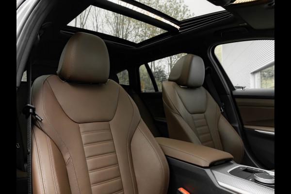 BMW 3 Serie Touring 330e M-Sport - Pano - LCI 2 - ACC - Trekhaak - Widescreen - Hifi