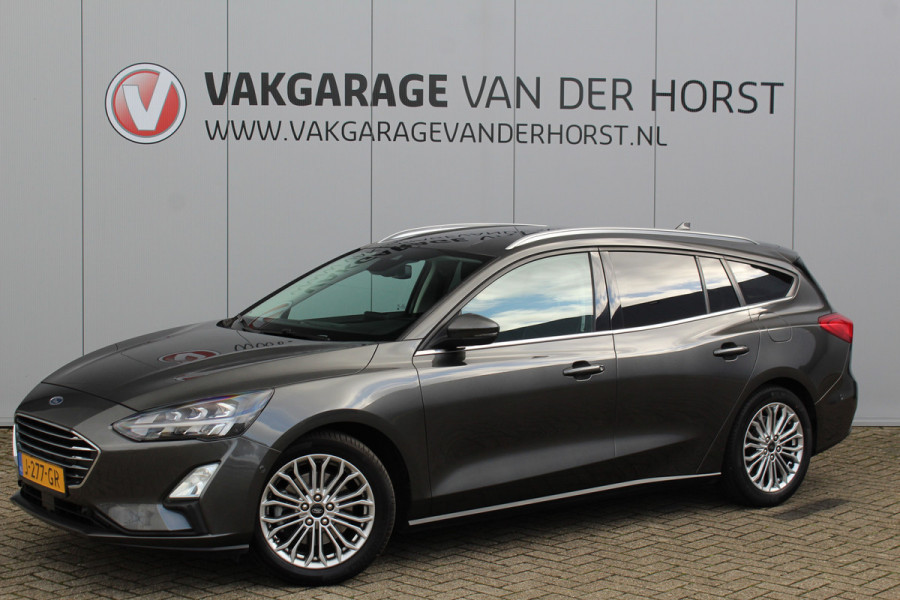 Ford FOCUS Wagon 1.0-125pk EcoBoost Titanium Business. Uiterst nette, comfortabele en ruime stationcar. Stoel-, stuur- en voorraamverw., Trekhaak, B&O soundsyst, lane assist, adaptieve cruise cntrl, camera a, LM wln, navigatie, telefoonvoorb. etc Ford FOCUS Wagon 1.0-125pk EcoBoost Titanium Business. Uiterst nette, comfortabele en ruime stationcar. Stoel-, stuur- en voorraamverw., Trekhaak, B&O soundsyst, lane assist, adaptieve cruise cntrl, camera a, LM wln, navigatie, telefoonvoorb. etc