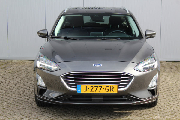 Ford FOCUS Wagon 1.0-125pk EcoBoost Titanium Business. Uiterst nette, comfortabele en ruime stationcar. Stoel-, stuur- en voorraamverw., Trekhaak, B&O soundsyst, lane assist, adaptieve cruise cntrl, camera a, LM wln, navigatie, telefoonvoorb. etc Ford FOCUS Wagon 1.0-125pk EcoBoost Titanium Business. Uiterst nette, comfortabele en ruime stationcar. Stoel-, stuur- en voorraamverw., Trekhaak, B&O soundsyst, lane assist, adaptieve cruise cntrl, camera a, LM wln, navigatie, telefoonvoorb. etc