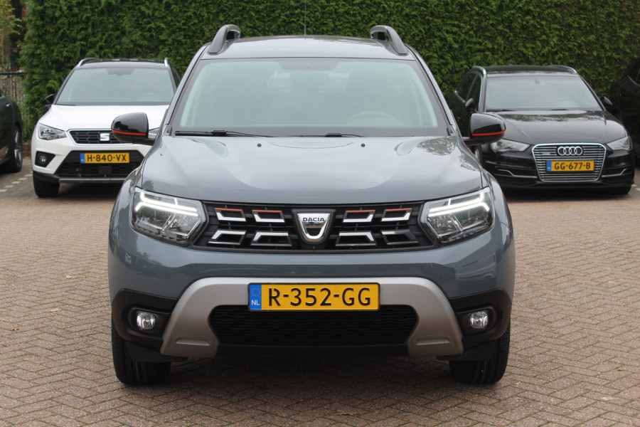 Dacia Duster 1.0 TCe 100 Bi-Fuel Journey / Full option! / Trekhaak / Camera / Half leder / 17'' / Keyless / Navigatie / DAB / Stoelverwarming / Cruise Control