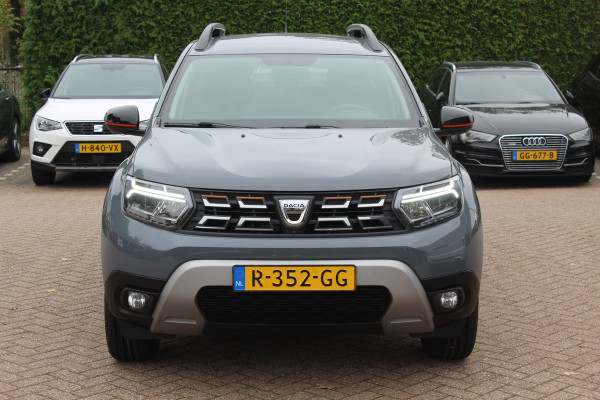 Dacia Duster 1.0 TCe 100 Bi-Fuel Journey / Full option! / Trekhaak / Camera / Half leder / 17'' / Keyless / Navigatie / DAB / Stoelverwarming / Cruise Control