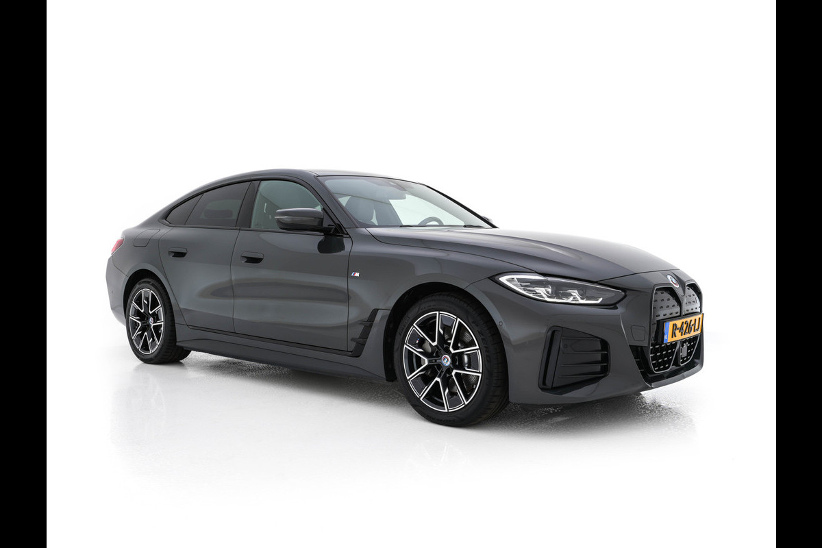 BMW i4 eDrive40 84 kWh M-Sportpack [ 3-Fase ] { SOH-95%} (INCL-BTW) *LEATHER-ALCANTARA | FULL-LED | ADAPTIVE-CRUISE | WIDE-SCREEN-DIGI-COCKPIT | DAB+ | CAMERA | AMBIENT-LIGHT | CARPLAY | SPORT-SEATS | PRIVACY-GLASS | TOWBAR | 18''ALU*