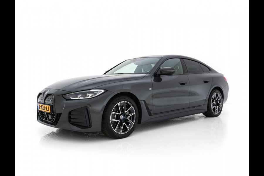 BMW i4 eDrive40 84 kWh M-Sportpack [ 3-Fase ] { SOH-95%} (INCL-BTW) *LEATHER-ALCANTARA | FULL-LED | ADAPTIVE-CRUISE | WIDE-SCREEN-DIGI-COCKPIT | DAB+ | CAMERA | AMBIENT-LIGHT | CARPLAY | SPORT-SEATS | PRIVACY-GLASS | TOWBAR | 18''ALU*