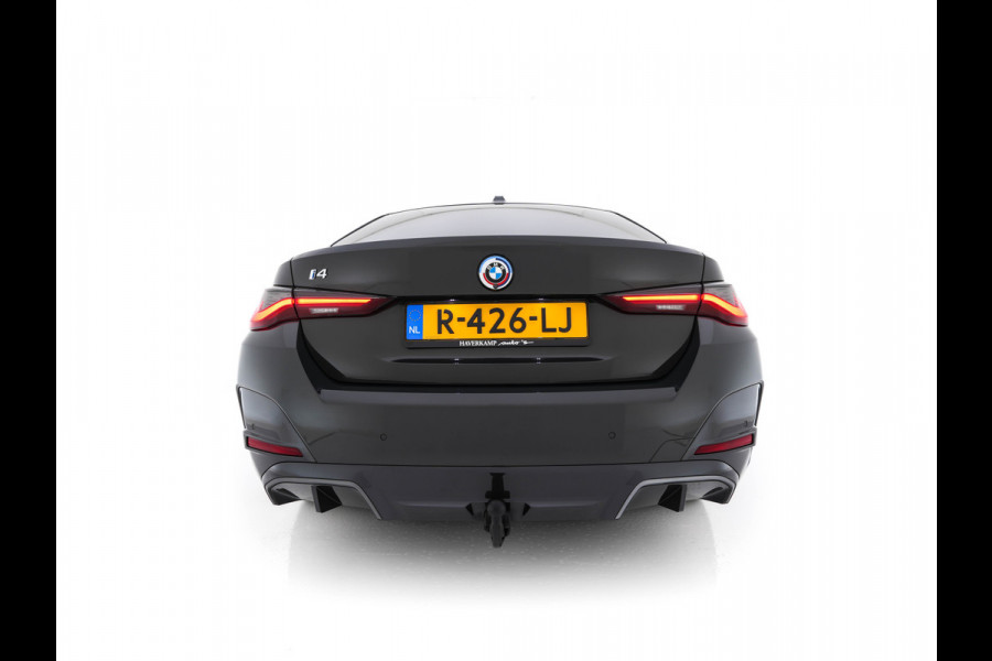 BMW i4 eDrive40 84 kWh M-Sportpack [ 3-Fase ] { SOH-95%} (INCL-BTW) *LEATHER-ALCANTARA | FULL-LED | ADAPTIVE-CRUISE | WIDE-SCREEN-DIGI-COCKPIT | DAB+ | CAMERA | AMBIENT-LIGHT | CARPLAY | SPORT-SEATS | PRIVACY-GLASS | TOWBAR | 18''ALU*