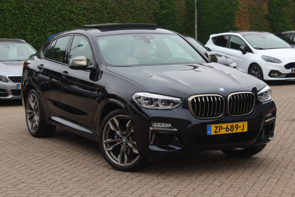 BMW X4 M40i High Executive / Trekhaak / Panoramadak / Camera / Head-up / Luxe Leder / 21'' / Harman Kardon / Navigatie / Stuur+Stoelverwarming / DAB / Dodehoek / Cruise Control BMW X4 M40i High Executive / Trekhaak / Panoramadak / Camera / Head-up / Luxe Leder / 21'' / Harman Kardon / Navigatie / Stuur+Stoelverwarming / DAB / Dodehoek / Cruise Control