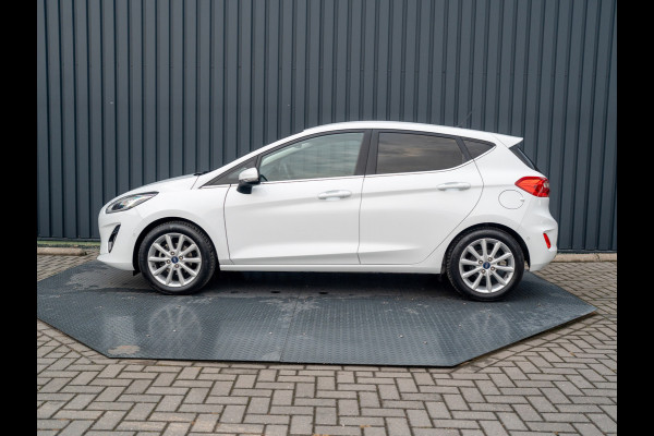 Ford Fiesta 1.0 EcoB. Aut. Titanium | Trekhaak | Stoel & Stuur verw. | Camera | Navi | PDC V&A | Prijs Rijklaar!! Ford Fiesta 1.0 EcoB. Aut. Titanium | Trekhaak | Stoel & Stuur verw. | Camera | Navi | PDC V&A | Prijs Rijklaar!!