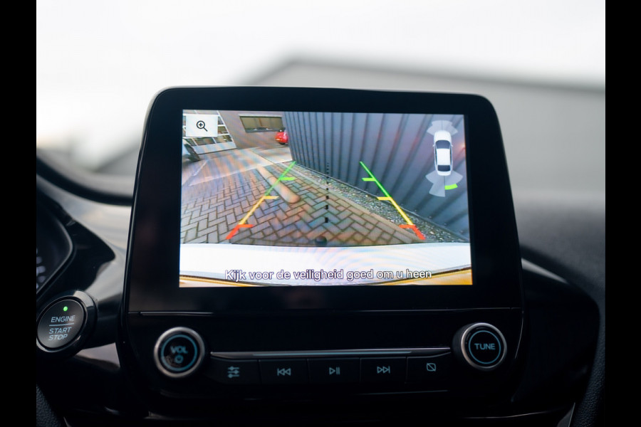 Ford Fiesta 1.0 EcoB. Aut. Titanium | Trekhaak | Stoel & Stuur verw. | Camera | Navi | PDC V&A | Prijs Rijklaar!! Ford Fiesta 1.0 EcoB. Aut. Titanium | Trekhaak | Stoel & Stuur verw. | Camera | Navi | PDC V&A | Prijs Rijklaar!!