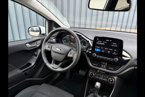Ford Fiesta 1.0 EcoB. Aut. Titanium | Trekhaak | Stoel & Stuur verw. | Camera | Navi | PDC V&A | Prijs Rijklaar!! Ford Fiesta 1.0 EcoB. Aut. Titanium | Trekhaak | Stoel & Stuur verw. | Camera | Navi | PDC V&A | Prijs Rijklaar!!