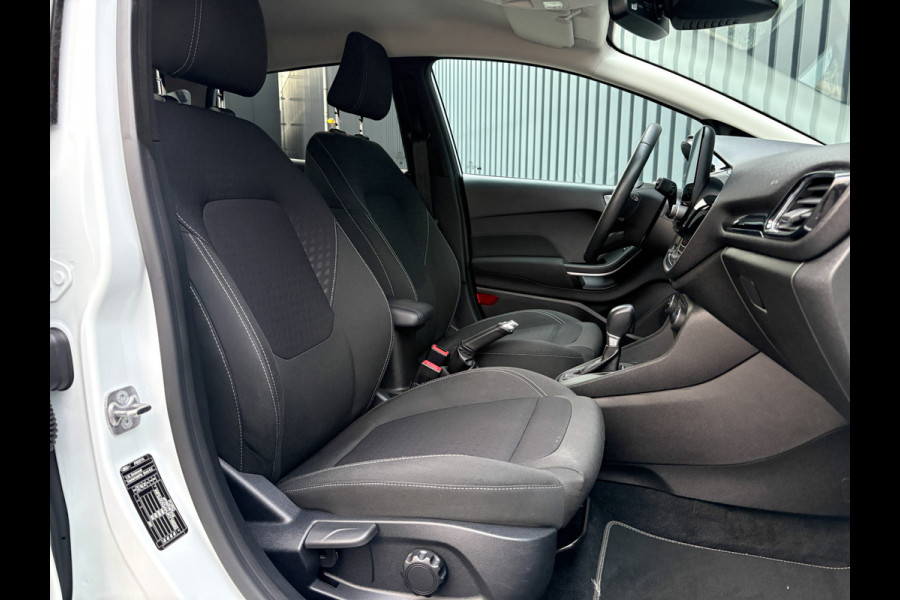 Ford Fiesta 1.0 EcoB. Aut. Titanium | Trekhaak | Stoel & Stuur verw. | Camera | Navi | PDC V&A | Prijs Rijklaar!! Ford Fiesta 1.0 EcoB. Aut. Titanium | Trekhaak | Stoel & Stuur verw. | Camera | Navi | PDC V&A | Prijs Rijklaar!!