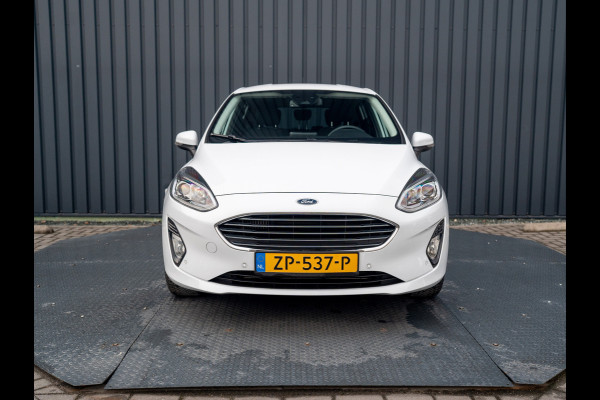Ford Fiesta 1.0 EcoB. Aut. Titanium | Trekhaak | Stoel & Stuur verw. | Camera | Navi | PDC V&A | Prijs Rijklaar!! Ford Fiesta 1.0 EcoB. Aut. Titanium | Trekhaak | Stoel & Stuur verw. | Camera | Navi | PDC V&A | Prijs Rijklaar!!