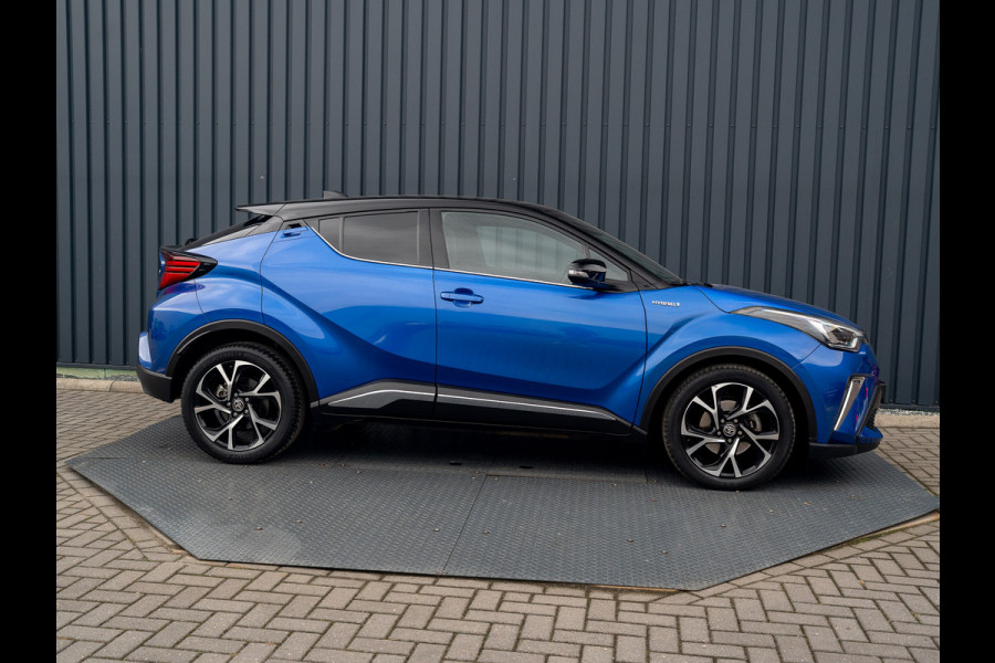 Toyota C-HR 1.8 Hybrid First Edition | Bi-Tone | JBL | Blind Spot | Navi | Pakeersensoren | Apple Carplay | Prijs Rijklaar!! Toyota C-HR 1.8 Hybrid First Edition | Bi-Tone | JBL | Blind Spot | Navi | Pakeersensoren | Apple Carplay | Prijs Rijklaar!!