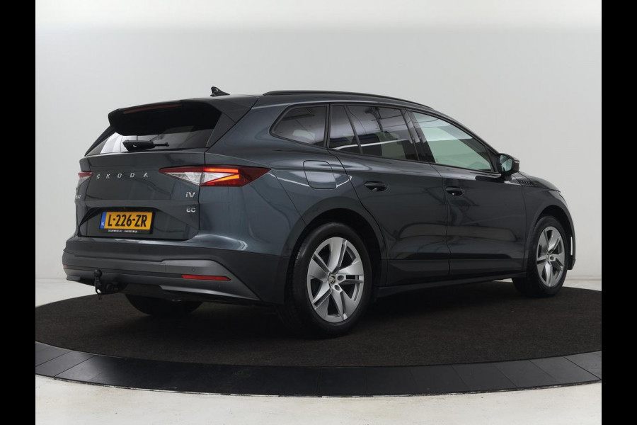 Škoda ENYAQ iV 60 | Trekhaak | Adaptive cruise | Camera | Keyless | Stuurverwarming | Half leder | 19'' | Carplay | Navigatie | Digital Cockpit | Full LED | File Assistent | Parkeerhulp