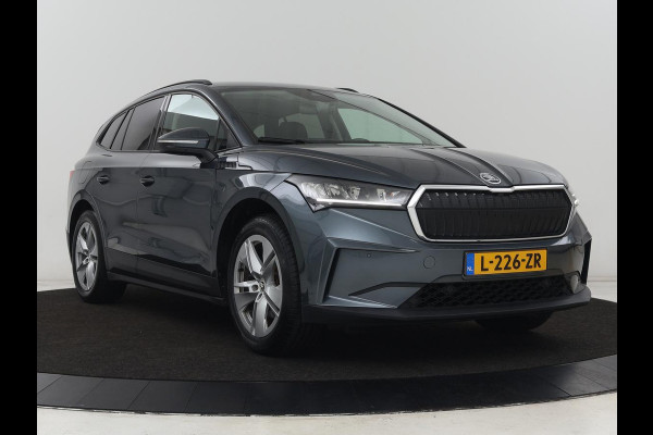 Škoda ENYAQ iV 60 | Trekhaak | Adaptive cruise | Camera | Keyless | Stuurverwarming | Half leder | 19'' | Carplay | Navigatie | Digital Cockpit | Full LED | File Assistent | Parkeerhulp