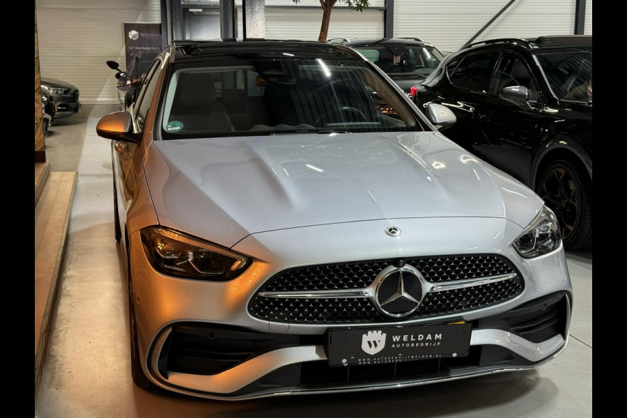 Mercedes-Benz C-Klasse Estate 300 e AMG Line Garantie Trekhaak Massage Pano Ambient 360 Blindspot Elek Achterklep StoelVW Rijklaar Mercedes-Benz C-Klasse Estate 300 e AMG Line Garantie Trekhaak Massage Pano Ambient 360 Blindspot Elek Achterklep StoelVW Rijklaar