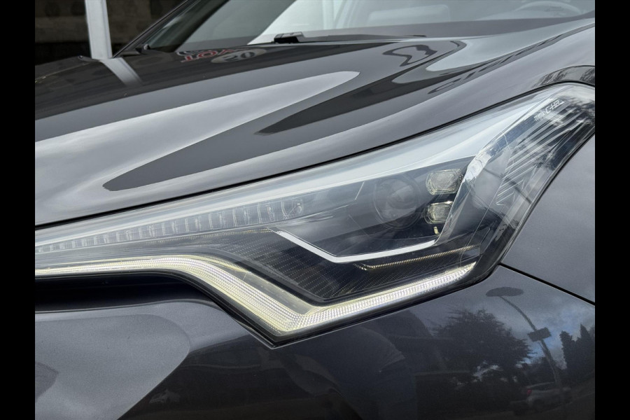 Toyota C-HR 1.8 Hybrid Bi-Tone Plus | Leer, Stoel + Stuurverwarming, Navigatie, Dodehoekherkenning, Parkeersensoren