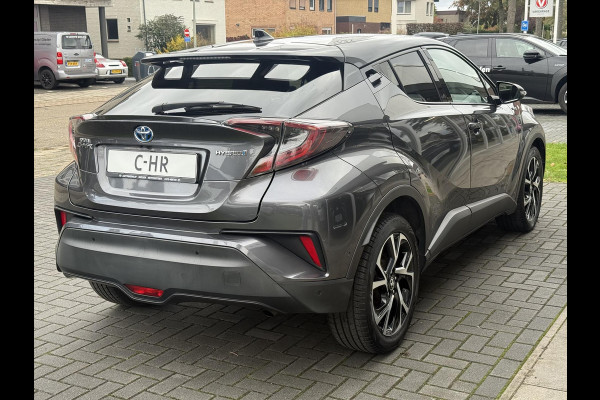 Toyota C-HR 1.8 Hybrid Bi-Tone Plus | Leer, Stoel + Stuurverwarming, Navigatie, Dodehoekherkenning, Parkeersensoren